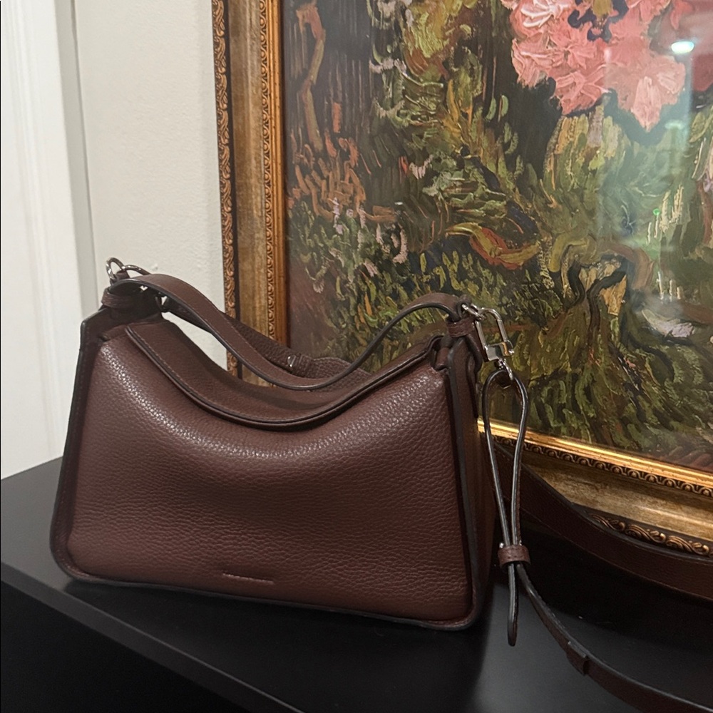 The Horse Leather Shoulder Bag Color is Coffee